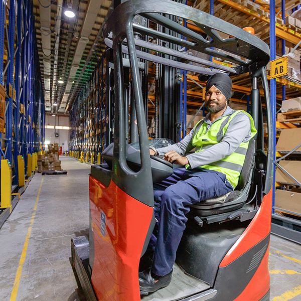 Worker on forklift